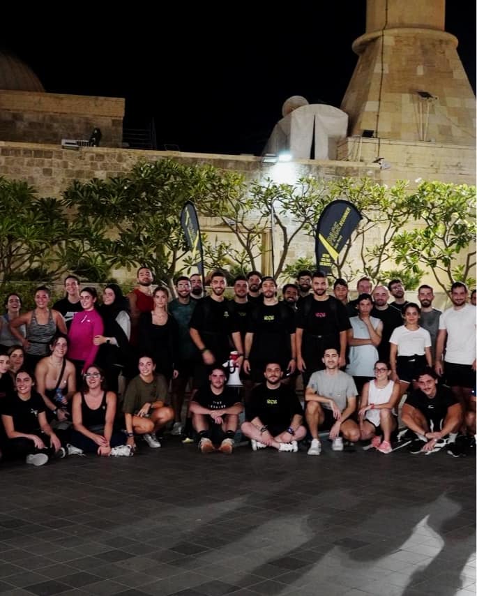 The whole Run Club Beirut community together in the city at night